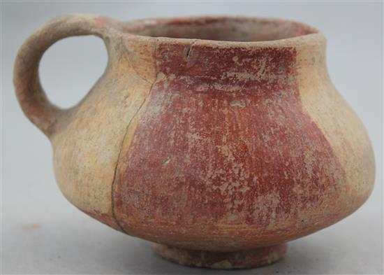 A Greek terracotta cup, c.2nd century BC, 8cm, repaired